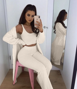 Detailed texture of white plush three-piece loungewear set with soft fuzzy cardigan