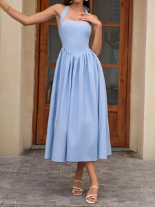 Detail of light blue halter dress featuring a pleated V-seam waist and A-line silhouette