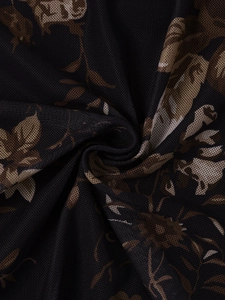 Macro shot of breathable black mesh fabric with vintage floral print and fine textures