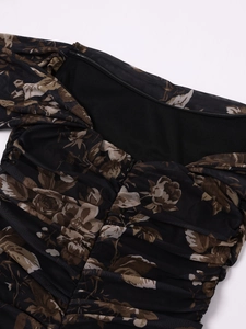 Detail of floral ruched mesh dress with back invisible zipper and sheer fabric texture