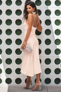 Detail of nude pink satin midi dress showing open back design and silky texture