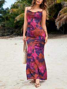 Detail of vibrant floral print maxi dress with tropical backless design for summer vacation