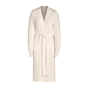 Detail of soft cream plush bathrobe showing thick coral fleece texture and belt design
