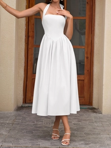 Detailed view of halter neck white midi dress with a V-shaped waist seam and gathered skirt