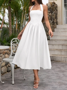 Detail of white halter neck dress featuring slim waist seam and elegant A-line flow