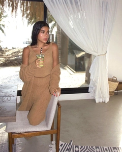 Three-piece camel plush knit loungewear set with cardigan and tank top in a cozy home setting