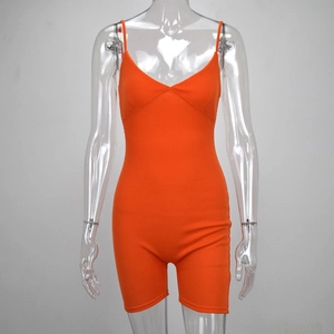 Detail view of orange ribbed knit romper featuring sleek V-neck and slim-fit sleeveless design