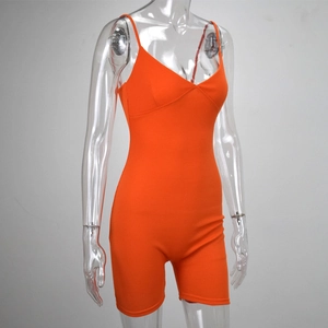 Close-up of bright orange rib-knit fabric texture on slim-fit v-neck romper