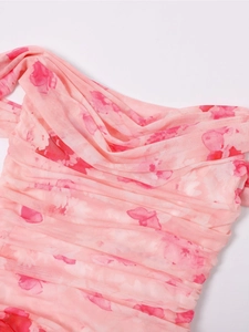Detail shot of sheer mesh fabric with pink floral print and gathered drape neckline