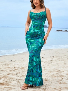 Detail of cowl neck design and abstract blue-green print on a silky summer dress