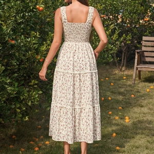 Floral square neck tiered dress with smocked back in a sunny citrus orchard setting