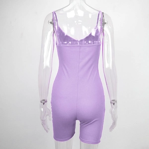 Back view of light purple ribbed knit bodysuit with slim straps and athletic silhouette