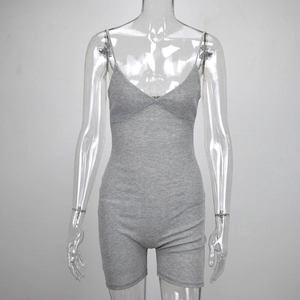 Close-up of grey ribbed knit romper featuring spaghetti straps and a sexy V-neckline