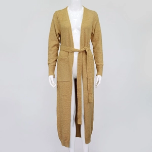 Detail of ginger plush long cardigan with waist tie belt and front pockets on mannequin