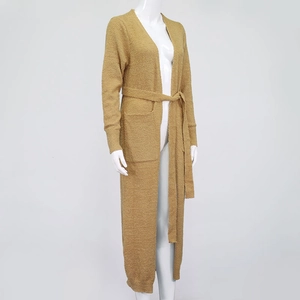 Detail of ginger plush cardigan showing soft knit texture and waist belt tie closure