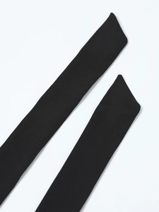 Detailed close-up of the black halter ties with neat diagonal cut ends for the dress