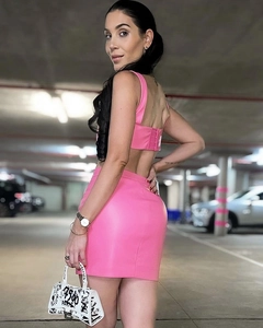 Detail of pink PU leather crop top with button back and matching mini skirt outfit