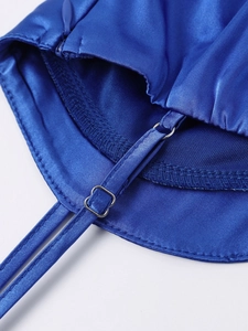 Detail of royal blue satin dress featuring adjustable metal buckle and invisible zipper
