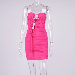 Detail of ruched hot pink bodycon dress with sexy lace-up cutout and mesh texture