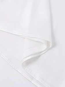 Close-up of high-quality sewing stitching and hem details on the white satin dress fabric