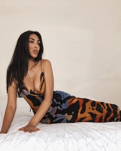Detail of slim fit backless maxi dress with orange and blue abstract art prints