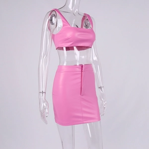 Detail of pink PU leather two-piece set featuring cropped tank top and zippered mini skirt