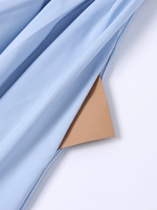 Detail of light blue midi dress showing side pocket and soft textured fabric weave