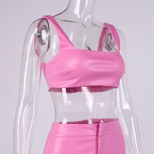 Detail of pink PU leather two-piece set featuring cropped tank top and high waist skirt