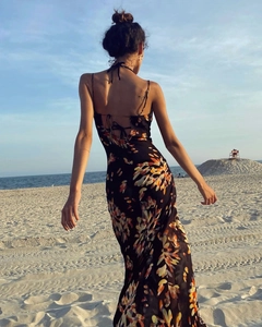 Detailed back view of a summer floral maxi dress featuring a lace-up backless design