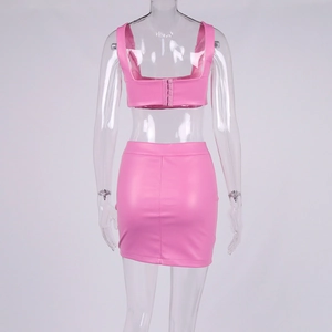 Rear view of pink PU leather set featuring cropped top with hook closure and mini skirt