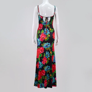 Detail of a backless floral maxi dress featuring a crisscross lace-up tie design