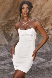 Detail of cowl neck with crisscross straps on white ruched bodycon mini dress