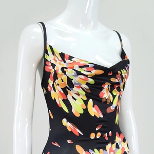 Close-up of vibrant floral print dress featuring a cowl neck and thin spaghetti straps