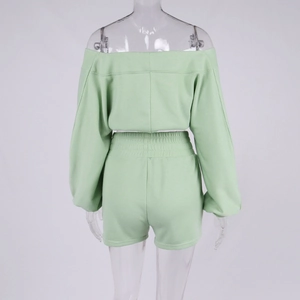 Back view of mint green crop V-neck sweatshirt and high-waist elastic shorts set