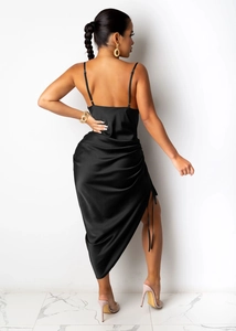 Close-up of black satin dress featuring a high side slit with adjustable drawstring detail