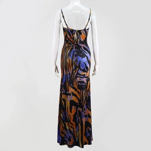 Detail view of the backless design with crisscross straps on the floral printed maxi dress
