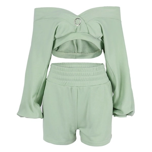 Green two-piece women lounge set with off-shoulder crop sweatshirt and matching shorts