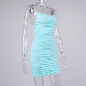 Detailed close-up of light blue ruched fabric texture on the backless mini dress