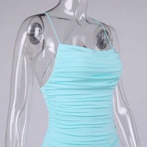 Detailed view of ice blue ruched bodycon dress showing textured stretch fabric