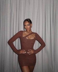 Close-up of deep brown bodycon dress featuring cross-cut neck and rib-knit texture