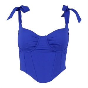 Bright blue corset top with bow shoulder straps and V-shaped hem on white background