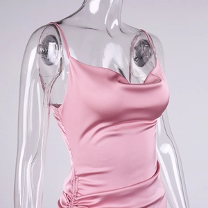 Detail of pink satin cowl neck dress featuring side ruching and elegant slim straps