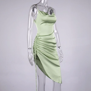 Detail of light green satin dress with side drawstring ruching and draped cowl neckline