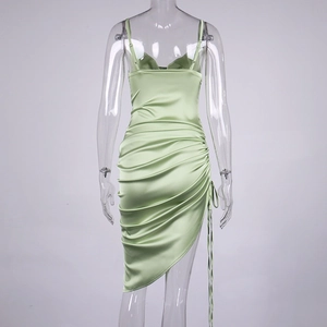 Detail of light green satin dress with adjustable drawstring ruching and slit design