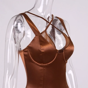 Detail of bronze satin bodysuit showing the cross strap neckline and bustier cups