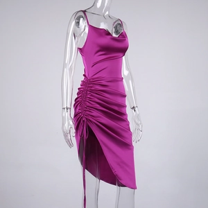 Detail of fuchsia satin midi dress featuring side drawstring ruching and cowl neck