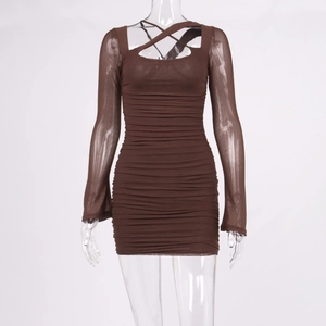 Detail of coffee brown ruched mesh dress featuring criss-cross neck and sheer long sleeves
