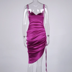 Detail of fuchsia satin slip dress showing backless design and drawstring ruching