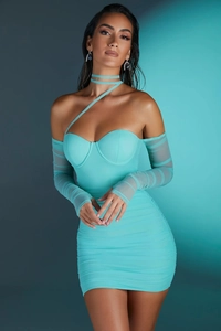 Detail of teal corset mini dress with ruched mesh sleeves and criss-cross neck tie