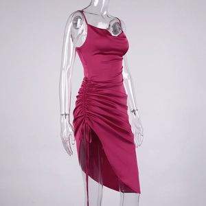 Detail of fuchsia satin dress with ruched drawstring and asymmetrical side slit